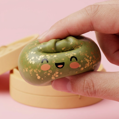 Dumpling Squishy Glitter Verde Esmeralda — efecto slow-rise, la espuma recupera su forma