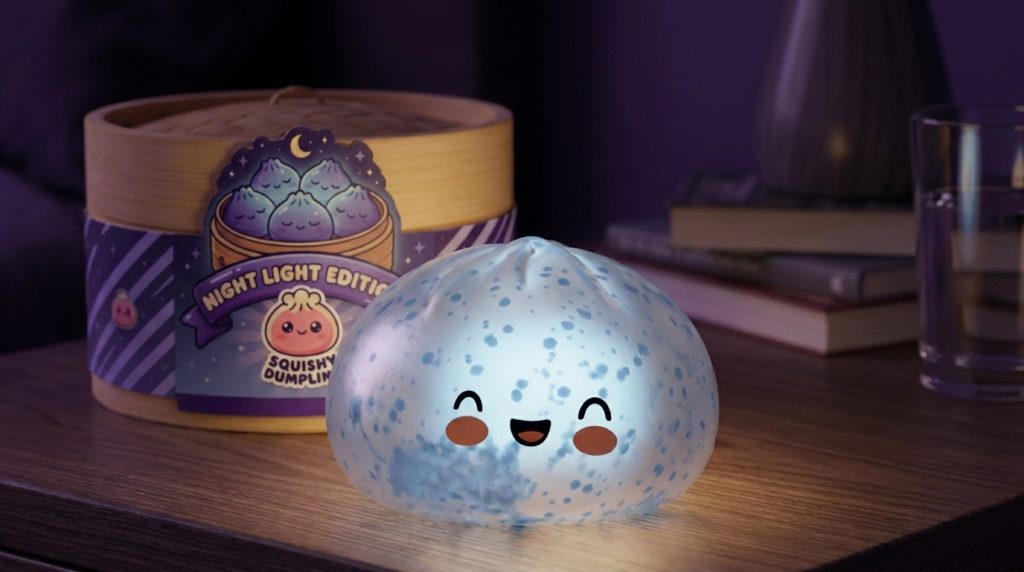 Dumpling Squishy Sparkle Azul Glaciar en un ambiente de escritorio