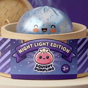 Dumpling Squishy Sparkle Azul Glaciar en su cesta de vapor de bambú