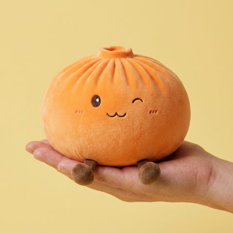 Giant Dumpling Squishy Naranja de Peluche en la mano, tamaño real