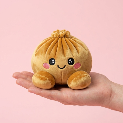 Squishy Dumpling Oro Real en la mano, tamaño real