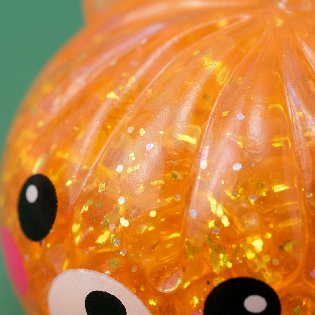 Dumpling Squishy Oso Mystery Glitter — primer plano macro de la textura