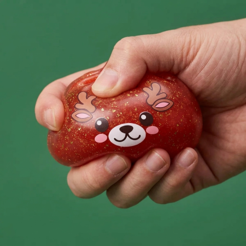 Squishy Dumpling Reno Rojo Glitter — efecto slow-rise, la espuma recupera su forma
